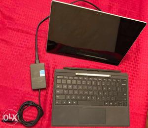 Surface pro 4 with pen and keyboard and bill