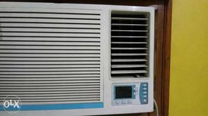 White And Teal Window Type Air Conditioner