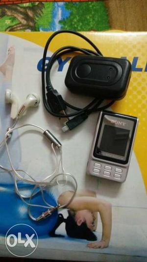 2 gb Sony mp3 player with charger and ear phones.