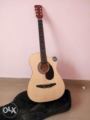 Beige And Brown Cut-away Acoustic Guitar