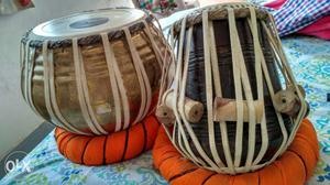 Two Brown And Black Conga Drums