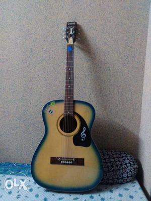 Brown And Blue Acoustic Guitar
