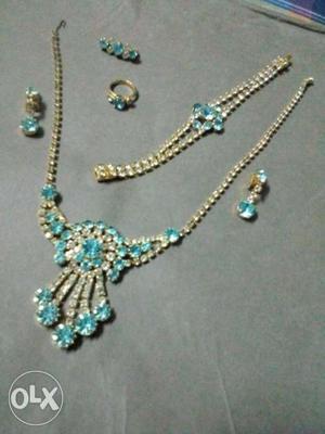 Gold And Blue Necklace, Earrings, Ring, And Bracelet Set