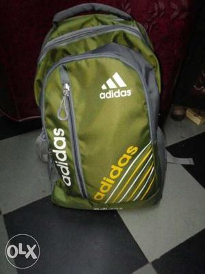Green colour laptop back pack with 4 compartments
