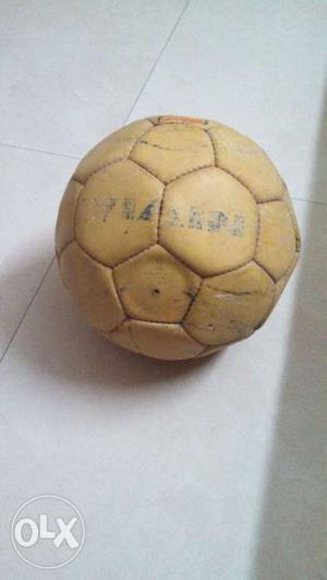 Its a nivea football of yellow color with orange