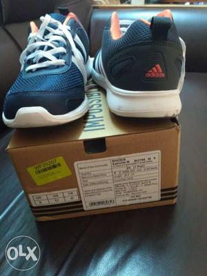 Pair Of Black And Blue Adidas Running Shoes