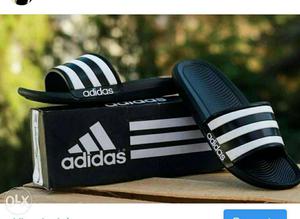 Pair Of Black-and-white Adidas Slippers On Box