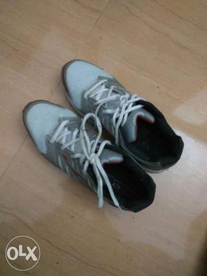Pair Of Gray-and-white Sneakers only used once