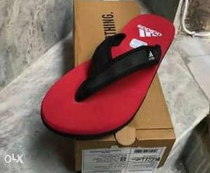 Red And Black Adidas Flipflop On Box