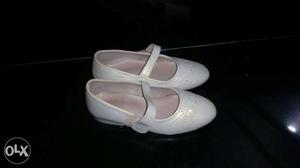 Silver off white shoes for baby girl hardly used.