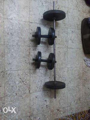 Two Black Dumbbells And One Barbell