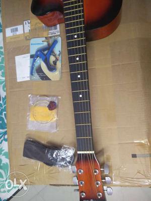 Unused guitar and accessories