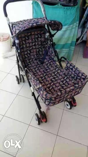 Baby's Purple And Black Stroller