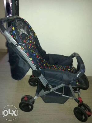 Black, Red, And Yellow Dotted Stroller