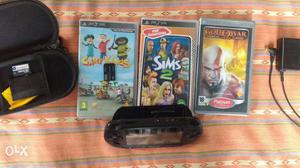 Black Sony PSP With Game Cases