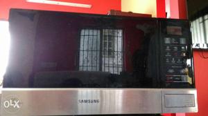 Stainless Steel And Black Samsung Microwave Oven