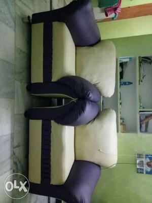 Two White And Purple Leather Sofa Chairs
