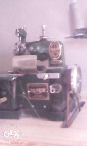 Green And Silver Sewing Machine