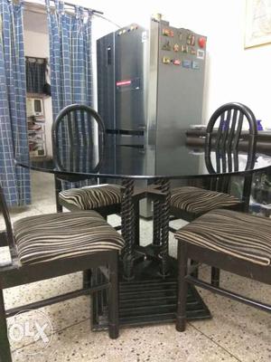 Strong four seater dining table with four chairs