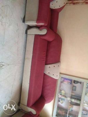 White And Pink Suede Three Seater Couch
