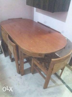 A dining table of SAGON WOOD with 6 chairs and 4