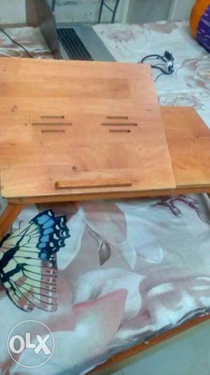 Adjustable wooden laptop table in very good