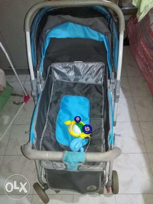 Baby's Blue And Gray Pram Stroller