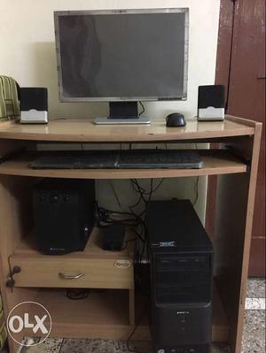 Black Computer Set-up And Brown Wooden Computer Tabe