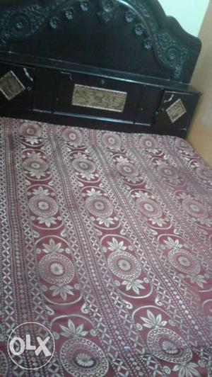 Black Wooden Headboard; Red Floral Bed Sheet