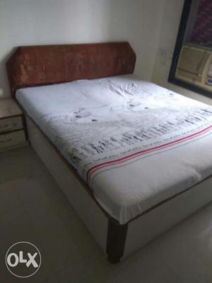 Brown Wooden Bed Frame With White Mattress