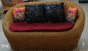 Cane sofa. 2 seater. hardly used. With mattress