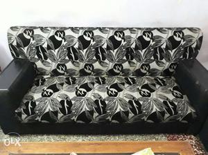 Five seater sofa with black and grey floral.In