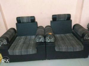 Two Gray And Black Club Chairs
