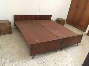 Two single cots with side tables