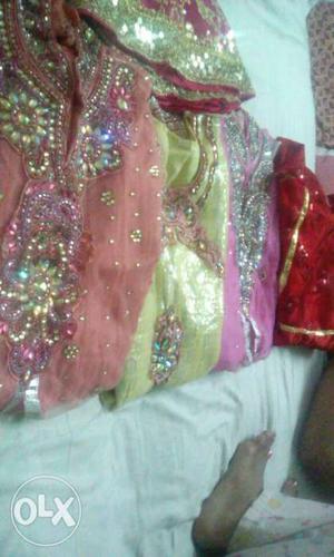 4 long frocks un used and 1 sharara all party