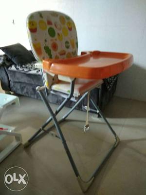 Baby's Orange And White Feeding Chair