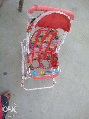 Baby's Red And White Bouncer Seat