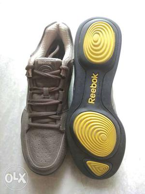 Pair Of Beige-and-yellow Reebok Low Top Sneakers