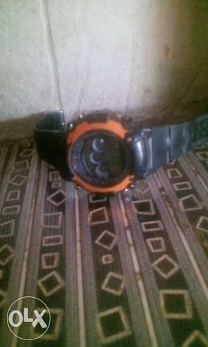 Round Orange Chronograph Watch With Black Strap