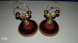Two Red-and-gold Jhumka Earrings