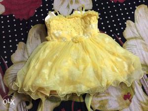 Yellow party wear dress for 6-9 months.used only