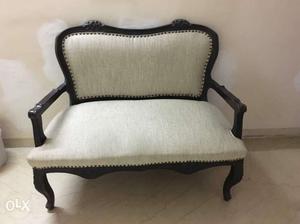 Black Wooden Base White Padded Couch