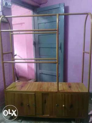 Brown Wooden Cabinet With Clothes Hanging Rack