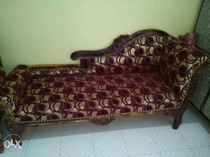 Brown Wooden Framed Gray And Red Padded Chaise Lounge