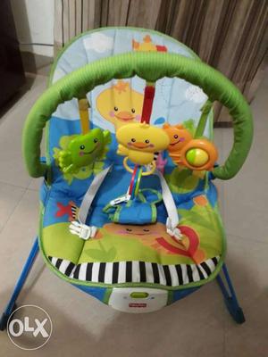 Green, Blue And White Fisher-Price Bouncer Seat