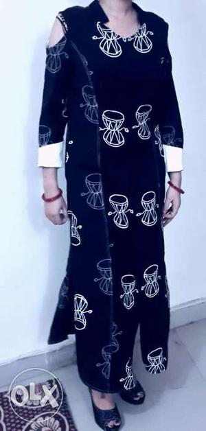 It's long black printed designer long Kurti. Size =M