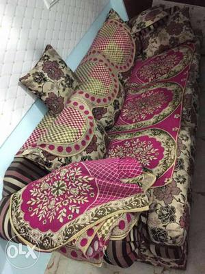 Pink, Brown, And Black Floral Couch With Three Throw Pillows