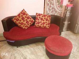 Red And Black Leather Couch With Round Ottoman