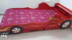 Red bed with mattress in good condition