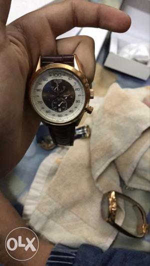 Round White And Gold Link Band Chronograph Watch